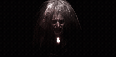 Woman With Veil Holding Candle GIF