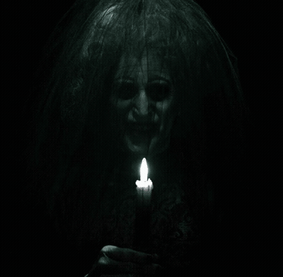 Woman With Veil Holding Lit Candle GIF