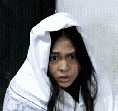 Woman With White Blanket On Head Making Funny Face GIF