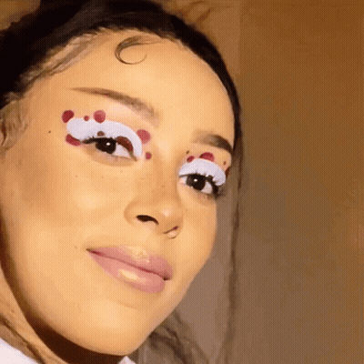Woman With White Eyelashes and Red Spots