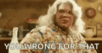 Woman With White Hair And Glasses Sitting GIF