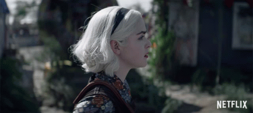 Woman With White Hair And Netflix Logo GIF