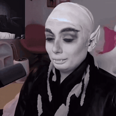 Woman With Wig And Scarf Saying I GIF