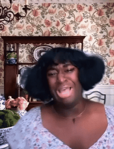 Woman With Wig Making Funny Face GIF
