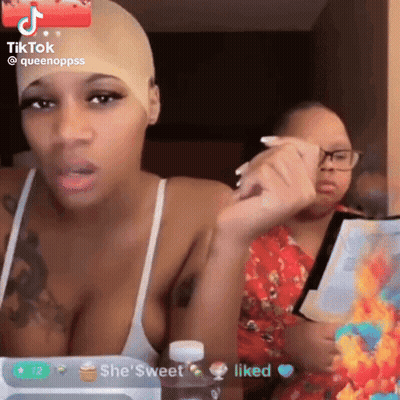 Woman With Wig Talking To Another Woman GIF