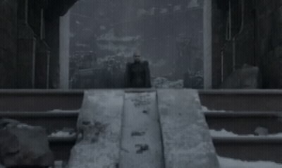 Woman With Wings Standing On Ledge In Dark Room GIF