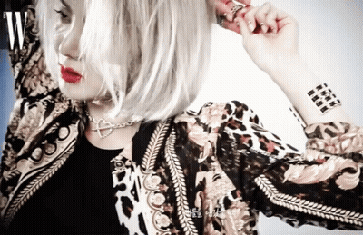 Woman With Wrist Tattoo Wearing Jacket GIF