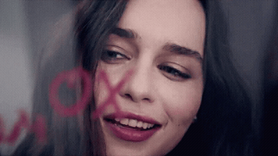 Woman With XOXO Painted On Face GIF