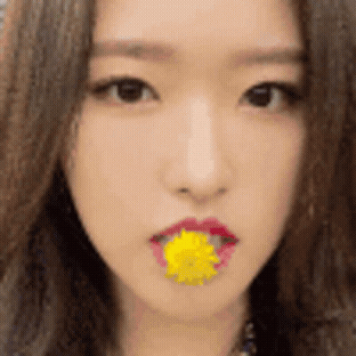 Woman With Yellow Flower In Mouth GIF