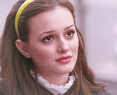 Woman With Yellow Headband Looking To Side GIF
