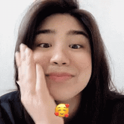 Woman With Yellow Smiley Face On Wrist GIF