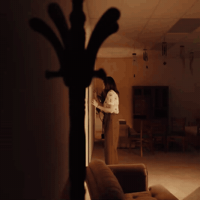 Woman With Yellow Wall GIF