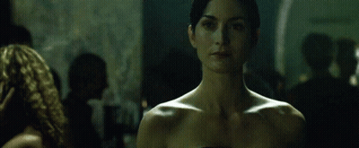 Woman Without Shirt Looking At Camera GIF