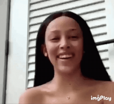 Woman Without Shirt Smiling At Camera GIF