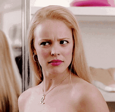 Woman Without Shirt Wearing Necklace With R GIF