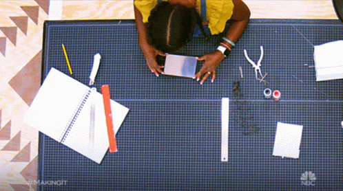 Woman Working On Cutting Mat With NBC Written GIF