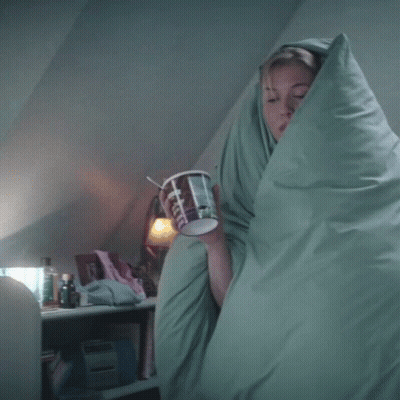 Woman Wrapped In Blanket Holding Coffee GIF