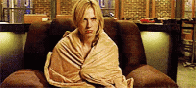 Woman Wrapped In Blanket In Chair GIF