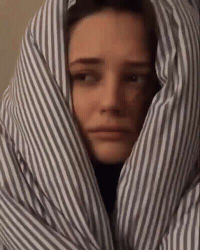 Woman Wrapped In Striped Blanket GIF