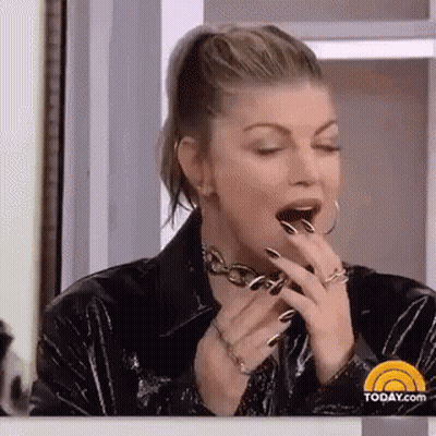 Woman Yawning In Black Leather Jacket GIF