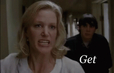 Woman Yelling At Man In Hallway GIF