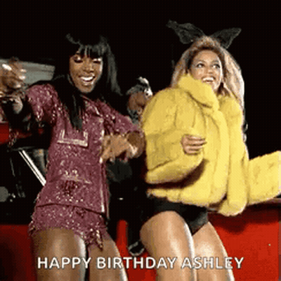 Women Dancing By Red Car, One In Yellow Fur Coat GIF