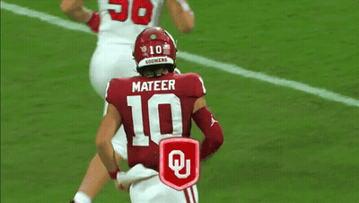 Women Dancing In Field With Mascot Wearing Oklahoma Shirt GIF