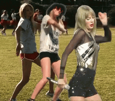 Women Dancing In Field With Taylor Swift Shirt GIF