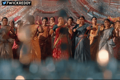 Women Dancing In Front Of 7Wickreddy Sign GIF