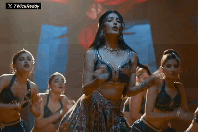 Women Dancing in Front of 7wickreddy Sign