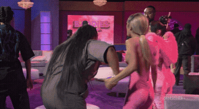 Women Dancing In Front Of Angels Sign GIF