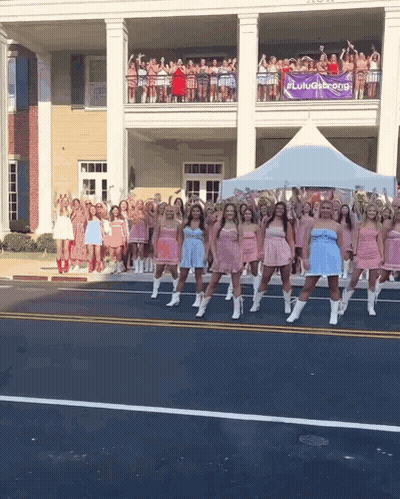 Women Dancing In Front Of Lulugang Sign GIF
