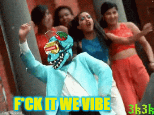 Women Dancing In Front Of Man Wearing Mask That Says Fck It We Vibe GIF