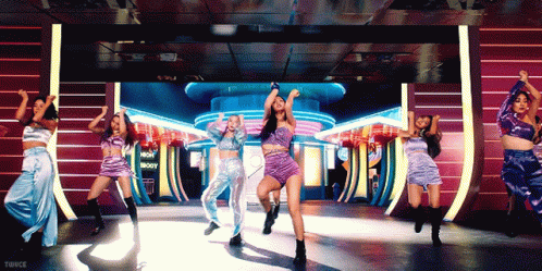 Women Dancing In Front Of Now Show Sign GIF