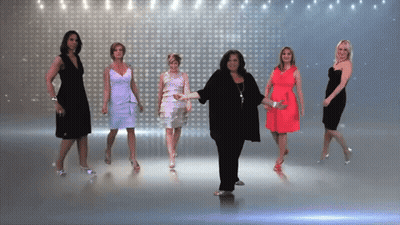 Women Dancing In Front Of Wall Of Lights GIF