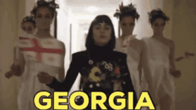 Women Dancing In Hallway With Georgia GIF