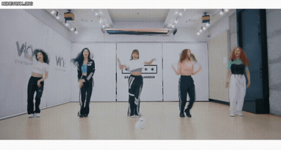 Women Dancing In Room With Amber Sign GIF