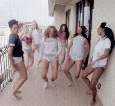 Women Dancing On Balcony In Underwear GIF