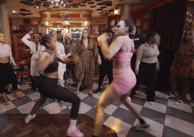 Women Dancing On Checkered Floor With Zcusd GIF