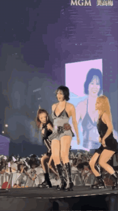 Women Dancing On Stage In Front Of MGM Screen GIF