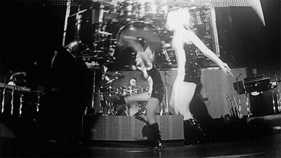 Women Dancing On Stage With Drummer GIF