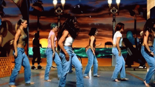 Women Dancing On Street In Jeans GIF