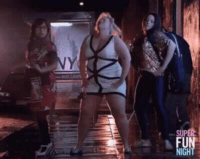 Women Dancing On Wet Sidewalk In Dark Alley GIF