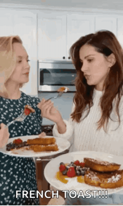 Women Eating French Toast In Kitchen GIF