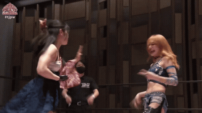 Women Holding Championship Belt On Stage GIF