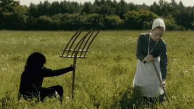 Women Holding Pitchforks