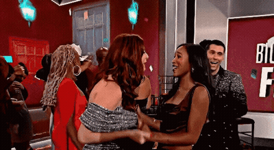 Women Hugging With Man Looking On GIF