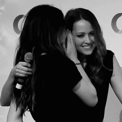 Women Hugging With Microphone GIF