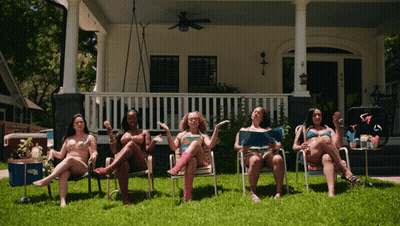 Women In Bikinis Sitting In Chairs GIF