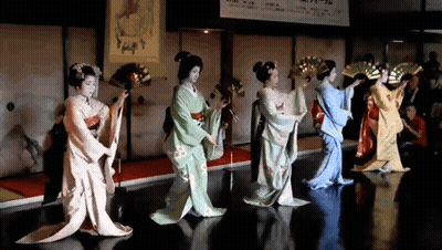 Women In Kimonos Dancing With Fans GIF